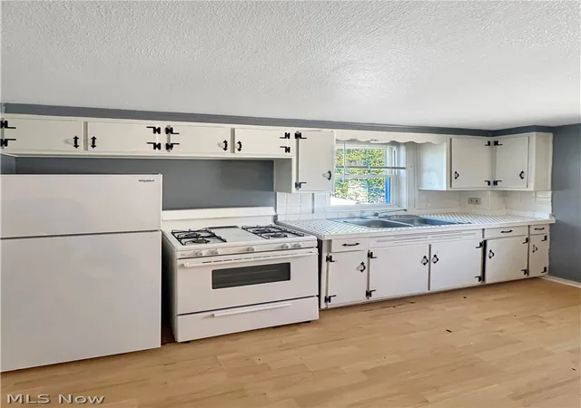 Photo 2 of Multi family home for sale at 1200 Wilbur Ave, Akron, OH 44301 | MLS# 5242446 | Listing updated on 2026-09-28