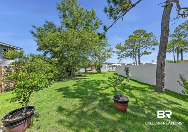 Photo 3 of Single family home for sale at 810 W Canal Dr, Gulf Shores, AL 36542 | MLS# 399560 | Listing updated on 2026-09-09