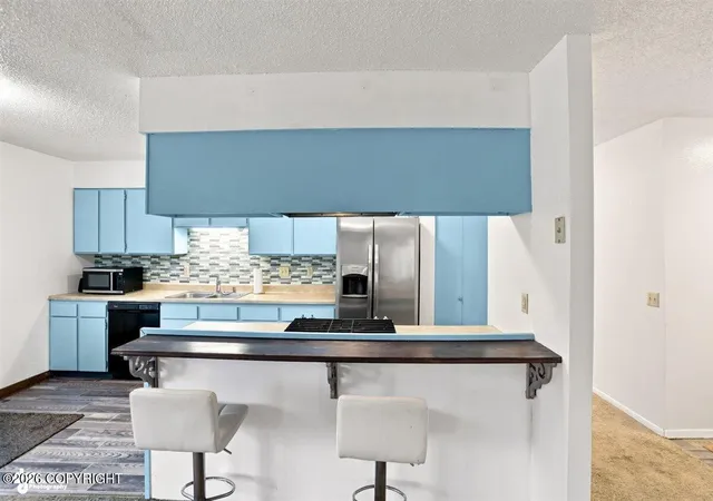 Photo 3 of Single family home for sale at 6930 Peck Ave, Anchorage, AK 99504 | MLS# 26-10160 | Listing updated on 2026-10-03