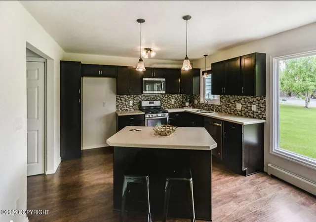 Photo 3 of Single family home for sale at 924 W 77th Avenue, Anchorage, AK 99518 | MLS# 26-10461 | Listing updated on 2026-09-23
