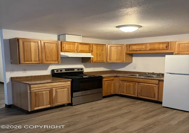 Photo 2 of Multi family home for sale at 138 N Klevin St, Anchorage, AK 99508 | MLS# 26-10869 | Listing updated on 2026-09-30