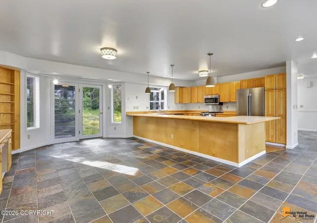 Photo 2 of Single family home for sale at 7050 E 99th Avenue, Anchorage, AK 99507 | MLS# 26-11769 | Listing updated on 2026-10-08