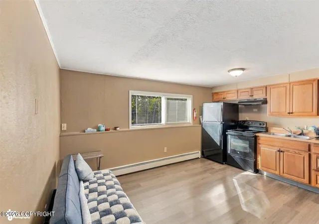 Photo 2 of Multi family home for sale at 7801 Island Dr, Anchorage, AK 99504 | MLS# 26-12355 | Listing updated on 2026-09-24