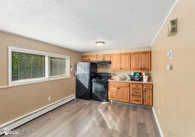 Photo 3 of Multi family home for sale at 7801 Island Dr, Anchorage, AK 99504 | MLS# 26-12355 | Listing updated on 2026-09-24