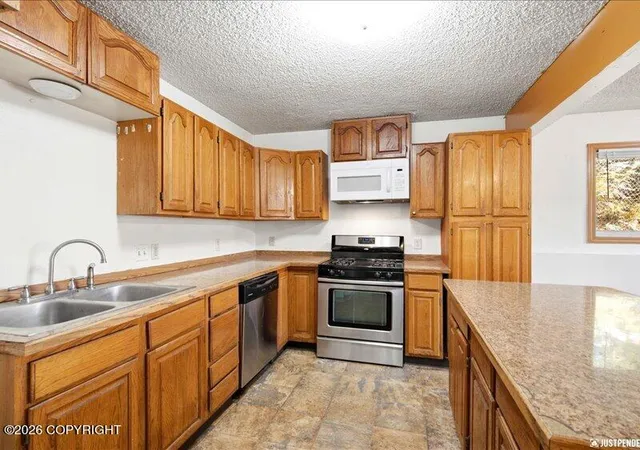 Photo 1 of Multi family home for sale at 621 E 73rd Avenue, Anchorage, AK 99518 | MLS# 26-12862 | Listing updated on 2026-10-07