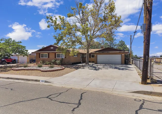 Photo 2 of Single family home for sale at 5909 Woodford Dr Ne, Albuquerque, NM 87110 | MLS# 1106915 | Listing updated on 2026-09-09