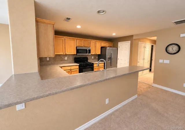 Photo 4 of Condo for sale at 9797 Mayfair St #F, Englewood, CO 80112 | MLS# 3804628 | Listing updated on 2026-09-11