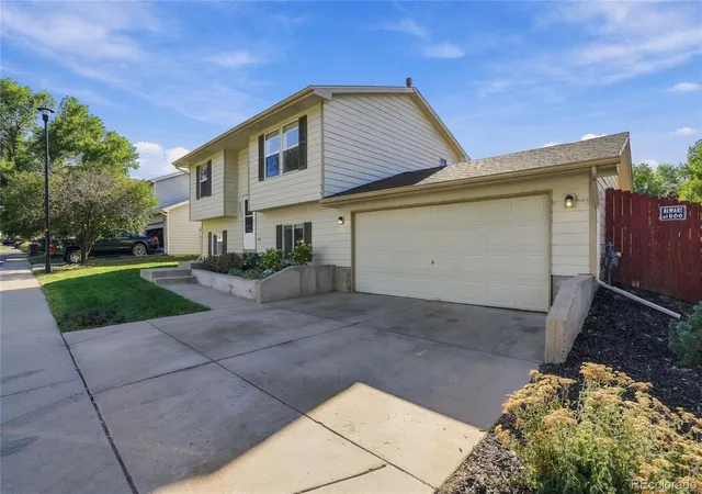 Photo 2 of Single family home for sale at 303 Sundance Pkwy, Dacono, CO 80514 | MLS# 1903873 | Listing updated on 2026-09-15