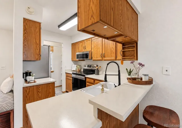 Listing Photo 4 - Condo for sale in building located at 1811 S Quebec Wy, Denver, CO 80231 - Unit #57