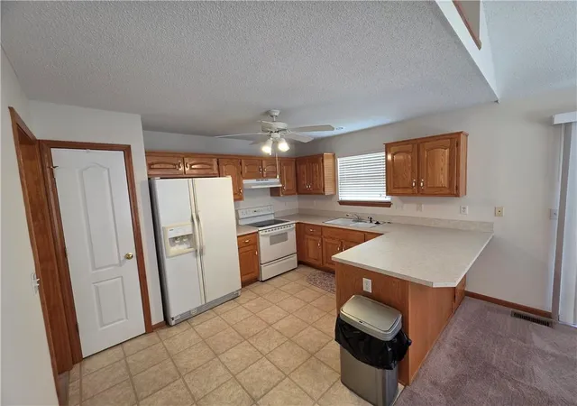 Photo 4 of Single family home for sale at 404 Blue Grass Dr, Raymore, MO 64083 | MLS# 2634042 | Listing updated on 2026-09-22