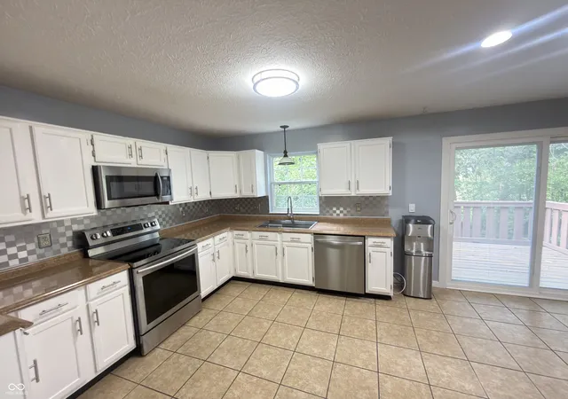Photo 3 of Single family home for sale at 3444 Garden Grv Dr, Indianapolis, IN 46214 | MLS# 22126074 | Listing updated on 2026-09-15