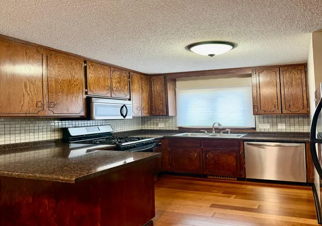 Photo 2 of Single family home for sale at 1552 Crk Meadows Dr Nw, Minneapolis, MN 55433 | MLS# 7118475 | Listing updated on 2026-09-14