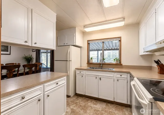 Photo 3 of Manufactured home for sale at 1402 22nd Street NE #214, Auburn, WA 98002 | MLS# NWM2517135 | Listing updated on 2026-09-21