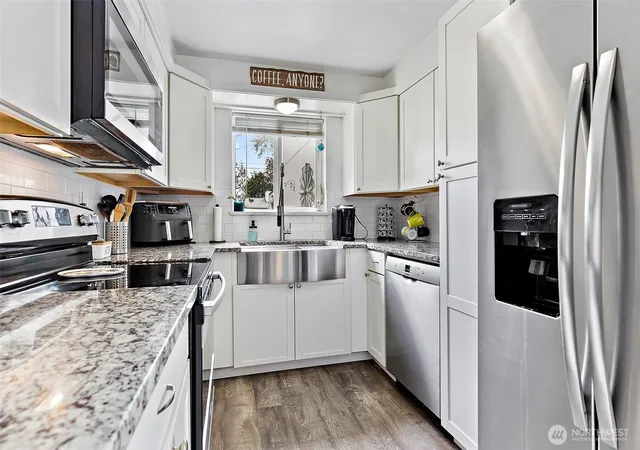 Photo 3 of Single family home for sale at 7402 E F St, Tacoma, WA 98404 | MLS# NWM2560521 | Listing updated on 2026-09-30