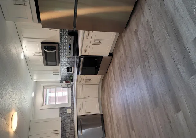 Photo 2 of Single family home for sale at 131 Village Cir W, Brookhaven, NY 11949 | MLS# 1001366 | Listing updated on 2026-09-13