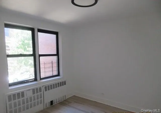 Listing Photo 1 - Condo for sale in building located at 2866 Marion Ave, New York City, NY 10458 - Unit #1E