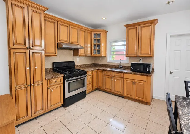 Photo 4 of Single family home for sale at 90-11 80th Street, New York, NY 11421 | MLS# 1047712 | Listing updated on 2026-09-13