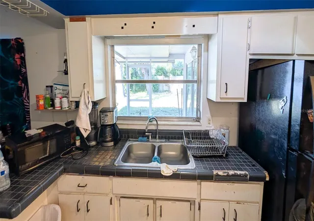Photo 4 of Single family home for sale at 1590 Peaceful Ln N, Clearwater, FL 33756 | MLS# TB8449176 | Listing updated on 2026-09-09