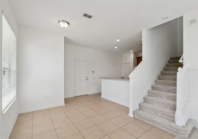 Photo 4 of Townhouse for sale at 1215 Shallcross Ave, Orlando, FL 32828 | MLS# O6364960 | Listing updated on 2026-09-11