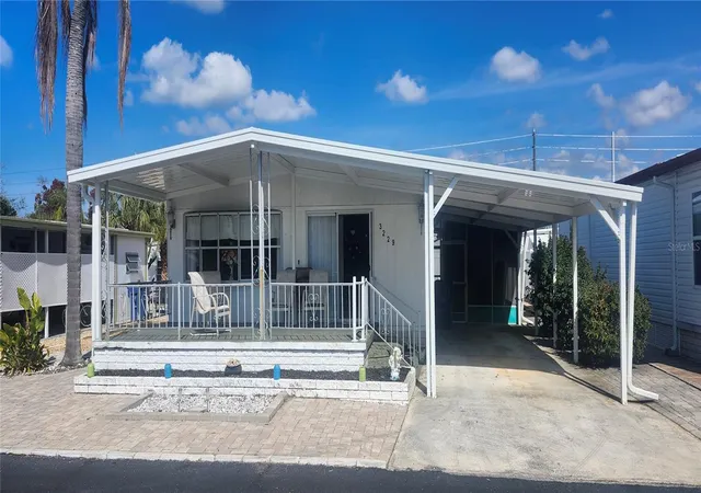 Photo 1 of Manufactured home for sale at 3229 Tiki Dr, Holiday, FL 34691 | MLS# W7883073 | Listing updated on 2026-09-15
