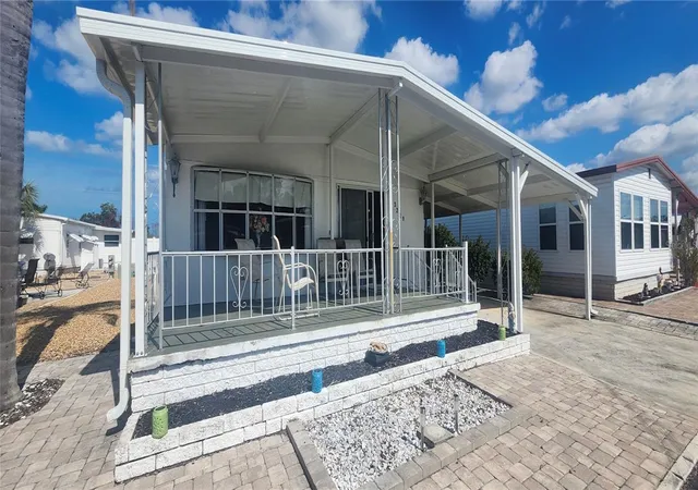 Photo 2 of Manufactured home for sale at 3229 Tiki Dr, Holiday, FL 34691 | MLS# W7883073 | Listing updated on 2026-09-15