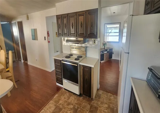 Photo 4 of Manufactured home for sale at 3229 Tiki Dr, Holiday, FL 34691 | MLS# W7883073 | Listing updated on 2026-09-15