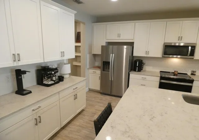 Photo 3 of Townhouse for sale at 1505 Sunset Wind Loop, Oldsmar, FL 34677 | MLS# W7883526 | Listing updated on 2026-09-11