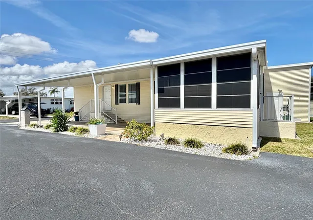 Photo 3 of Manufactured home for sale at 136 Americana Ct NE #230, St Petersburg, FL 33702 | MLS# TB8484211 | Listing updated on 2026-10-06