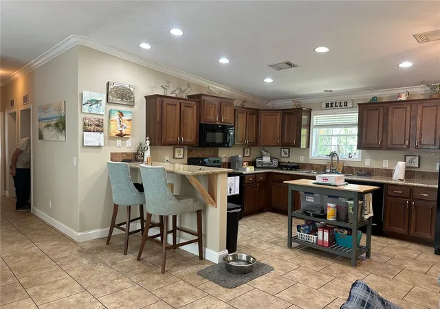 Photo 3 of Manufactured home for sale at 462 S Dew Plant Point, Crystal River, FL 34429 | MLS# TB8500543 | Listing updated on 2026-09-08