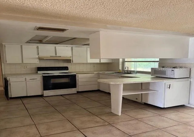 Photo 3 of Sale Pending at 8811 Goshen Ln, Port Richey, FL 34668 | MLS# W7885530 | Listing updated on 2026-09-11