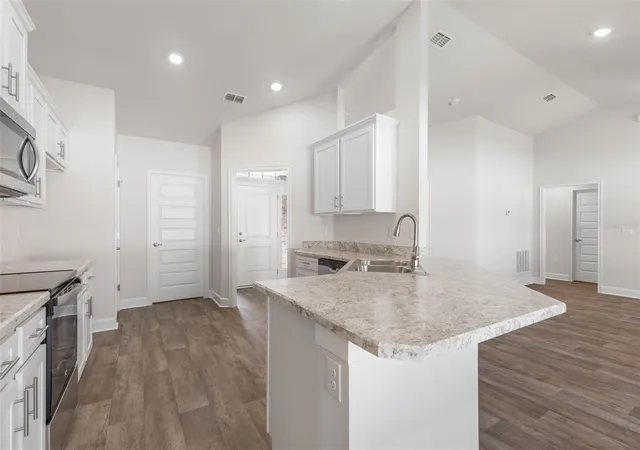Photo 4 of Single family home for sale at 105 Palmwood Dr, Palm Coast, FL 32164 | MLS# FC318347 | Listing updated on 2026-10-03