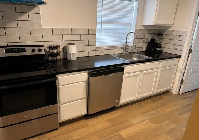 Photo 3 of Single family home for sale at 905 Avenue E Ne, Winter Haven, FL 33881 | MLS# TB8520126 | Listing updated on 2026-09-10