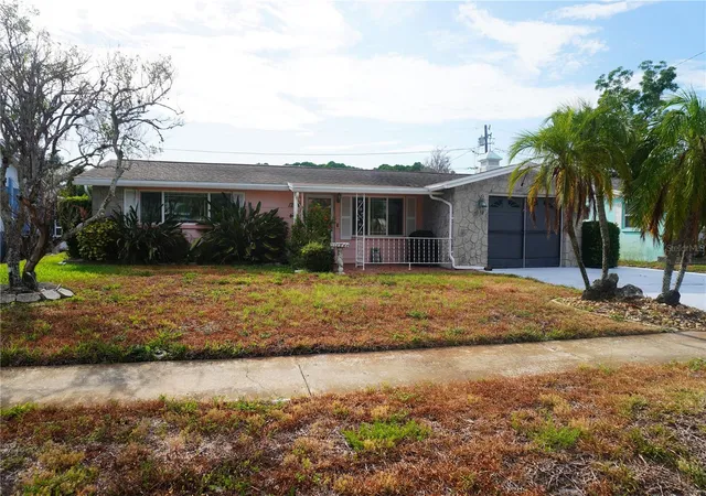Photo 1 of Single family home for sale at 1248 Ermine Dr, Holiday, FL 34690 | MLS# TB8523522 | Listing updated on 2026-09-26