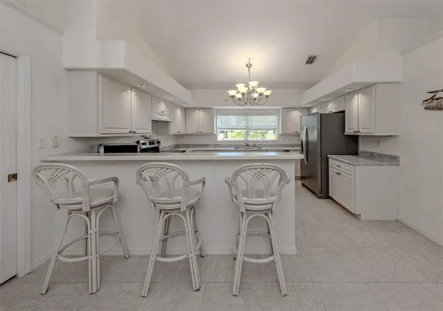 Photo 4 of Single family home for sale at 1056 Rotonda Cir, Rotonda West, FL 33947 | MLS# TB8525900 | Listing updated on 2026-09-14