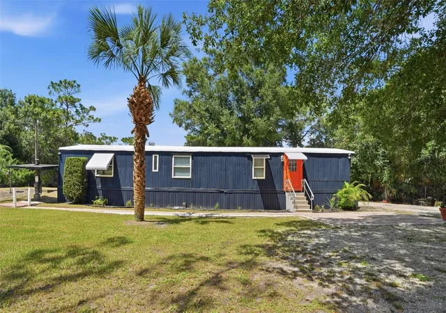 Photo 2 of Manufactured home for sale at 9295 Luna Dr, Saint Cloud, FL 34773 | MLS# S5154409 | Listing updated on 2026-09-12
