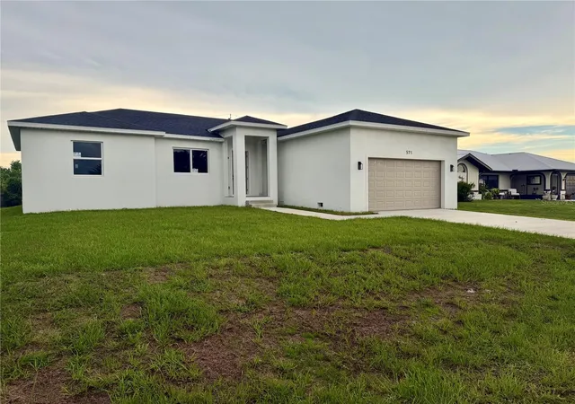 Photo 2 of Single family home for sale at 571 Mimosa Ave Nw, Port Charlotte, FL 33952 | MLS# O6428536 | Listing updated on 2026-10-02