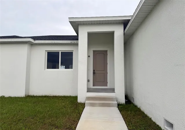 Photo 3 of Single family home for sale at 571 Mimosa Ave NW, Port Charlotte, FL 33952 | MLS# O6428536 | Listing updated on 2026-10-02