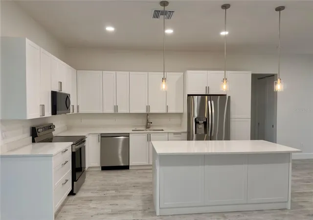 Photo 4 of Single family home for sale at 571 Mimosa Ave NW, Port Charlotte, FL 33952 | MLS# O6428536 | Listing updated on 2026-10-02