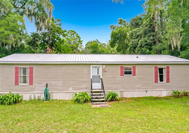 Photo 2 of Manufactured home for sale at 1021 NW 111th Court, Ocala, FL 34482 | MLS# OM729676 | Listing updated on 2026-09-12