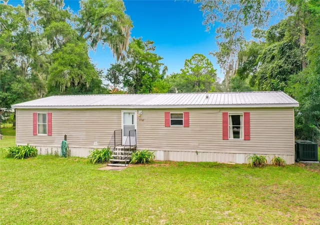 Photo 4 of Manufactured home for sale at 1021 NW 111th Court, Ocala, FL 34482 | MLS# OM729676 | Listing updated on 2026-09-12