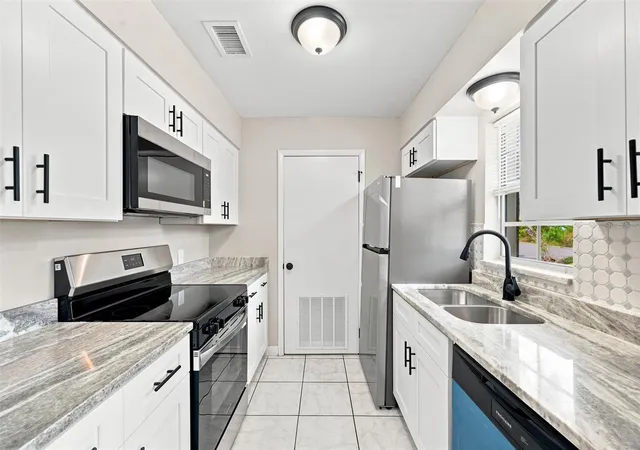 Photo 3 of Condo for sale at 4215 E Bay Dr #405, Clearwater, FL 33764 | MLS# TB8535412 | Listing updated on 2026-10-09