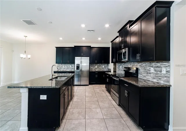 Photo 4 of Single family home for sale at 9850 Magnolia Woods Blvd, Orlando, FL 32832 | MLS# O6432644 | Listing updated on 2026-09-15