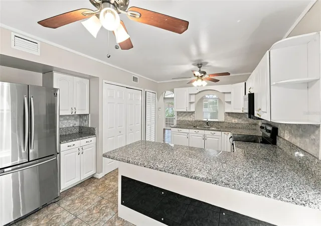 Photo 4 of Single family home for sale at 2411 Parsons Pond Cir, Kissimmee, FL 34743 | MLS# O6432819 | Listing updated on 2026-09-15