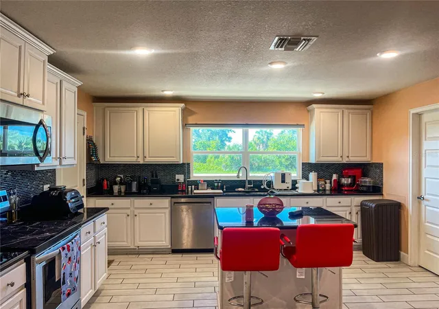 Photo 4 of Single family home for sale at 10125 Audrey St, Port Charlotte, FL 33981 | MLS# A4702858 | Listing updated on 2026-10-08
