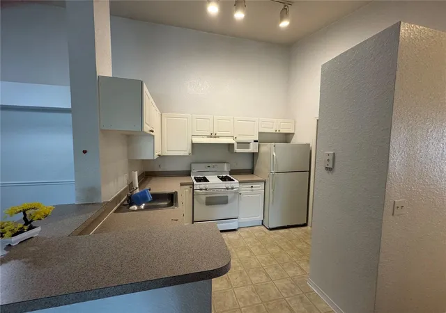 Listing Photo 1 - Condo for sale in building located at 3325 S Kirkman Rd, Orlando, FL 32811 - Unit #438