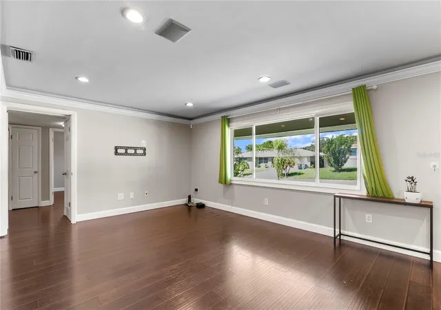 Photo 3 of Single family home for sale at 1009 Woodley Rd, Clearwater, FL 33764 | MLS# TB8543625 | Listing updated on 2026-09-12
