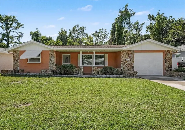 Photo 1 of Single family home for sale at 2641 Flintwood Dr, Holiday, FL 34690 | MLS# O6438494 | Listing updated on 2026-09-11