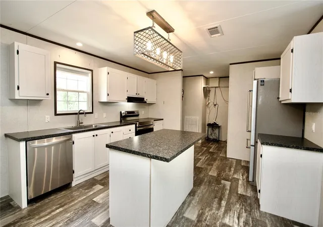 Photo 4 of Manufactured home for sale at 9669 Marley Ave, New Port Richey, FL 34654 | MLS# W7889171 | Listing updated on 2026-09-10