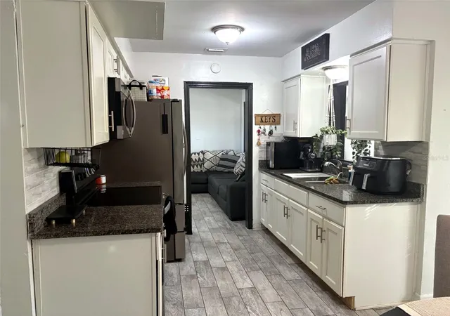 Photo 4 of Single family home for sale at 5917 Wolf Rd, Orlando, FL 32808 | MLS# O6439231 | Listing updated on 2026-09-09