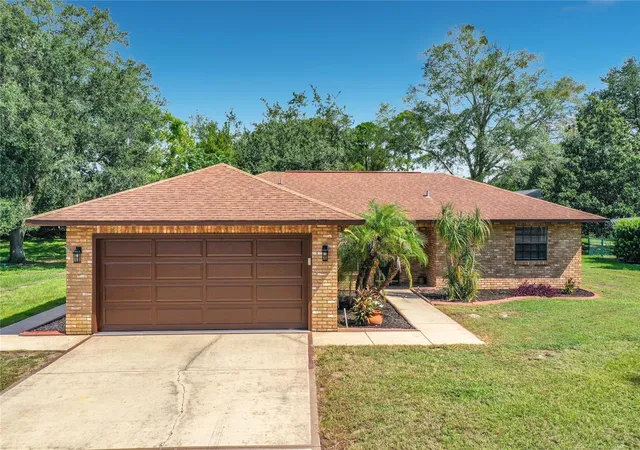 Single family home for sale at 12505 Wedgefield Dr, GRAND ISLAND, FL 32735 | MLS# O6439260